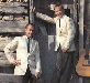 The Louvin Brothers in Front of a Log Cabin